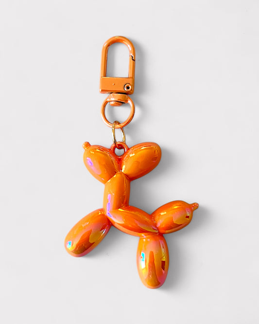 Metallic orange balloon dog charm